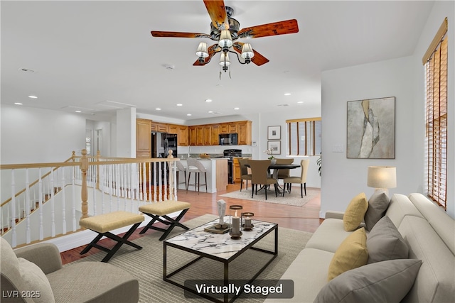 11247 Villa Trentino Ct, Las Vegas, NV 89141 - living room featuring a ceiling fan, light wood-type flooring, and recessed lighting