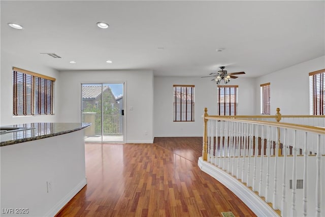 11247 Villa Trentino Ct, Las Vegas, NV 89141 - hallway featuring baseboards, healthy amount of natural light, wood finished floors, and recessed lighting