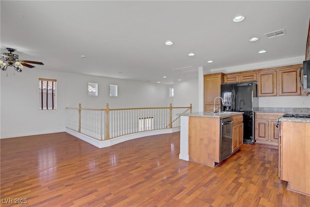 11247 Villa Trentino Ct, Las Vegas, NV 89141 - kitchen with stainless steel appliances, ceiling fan, dark wood finished floors, open floor plan, and recessed lighting