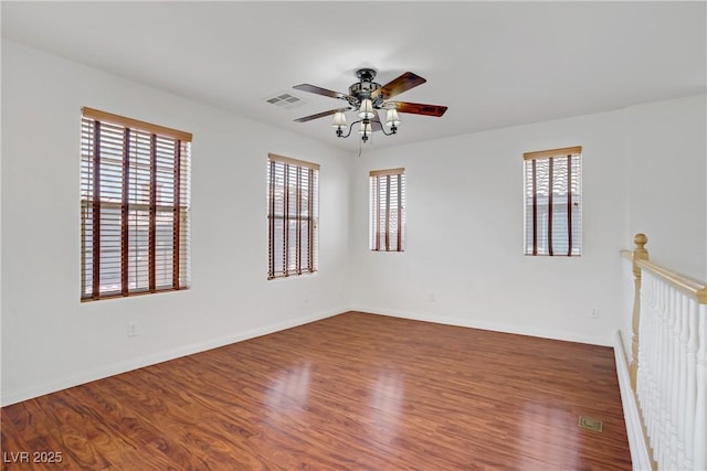 11247 Villa Trentino Ct, Las Vegas, NV 89141 - empty room with ceiling fan, wood finished floors, and baseboards