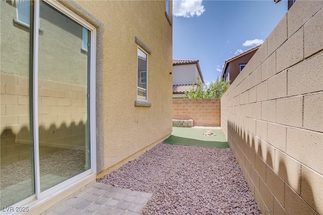 11247 Villa Trentino Ct, Las Vegas, NV 89141 - view of home's exterior with a fenced backyard, stucco siding, and a patio area