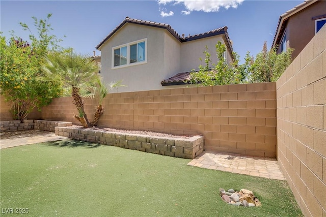 11247 Villa Trentino Ct, Las Vegas, NV 89141 - fenced backyard with a patio