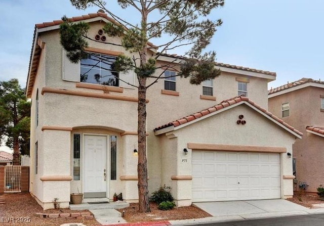 971 Whispering Grove Ave, Las Vegas, NV 89123 - mediterranean / spanish house featuring a tiled roof, stucco siding, a garage, and driveway