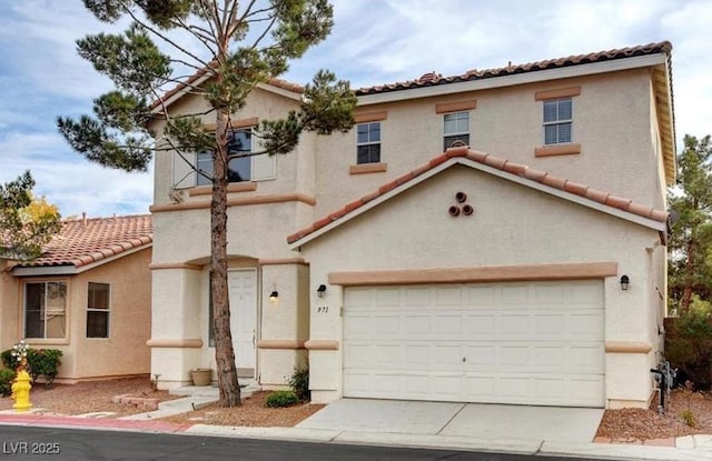 971 Whispering Grove Ave, Las Vegas, NV 89123 - mediterranean / spanish-style home with a tile roof, an attached garage, stucco siding, and concrete driveway