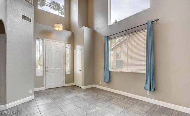 971 Whispering Grove Ave, Las Vegas, NV 89123 - tiled entryway with a towering ceiling and baseboards