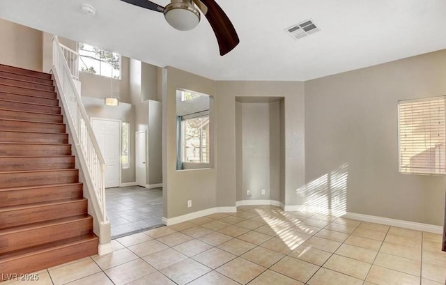 971 Whispering Grove Ave, Las Vegas, NV 89123 - empty room featuring light tile patterned flooring, a ceiling fan, and healthy amount of natural light