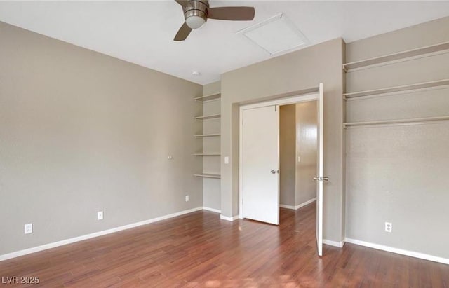 971 Whispering Grove Ave, Las Vegas, NV 89123 - unfurnished bedroom featuring attic access, baseboards, and wood finished floors
