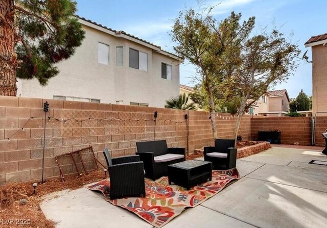 971 Whispering Grove Ave, Las Vegas, NV 89123 - view of patio featuring a fenced backyard and an outdoor living space
