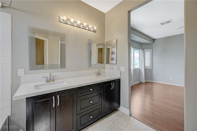 971 Whispering Grove Ave, Las Vegas, NV 89123 - bathroom featuring double vanity and wood finished floors