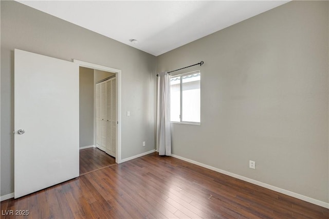 971 Whispering Grove Ave, Las Vegas, NV 89123 - unfurnished bedroom with wood finished floors and a closet