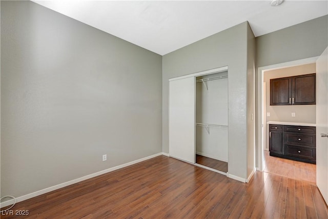971 Whispering Grove Ave, Las Vegas, NV 89123 - unfurnished bedroom featuring wood finished floors and a closet