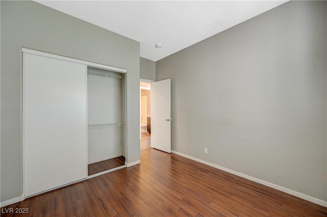 971 Whispering Grove Ave, Las Vegas, NV 89123 - unfurnished bedroom with a closet and wood finished floors