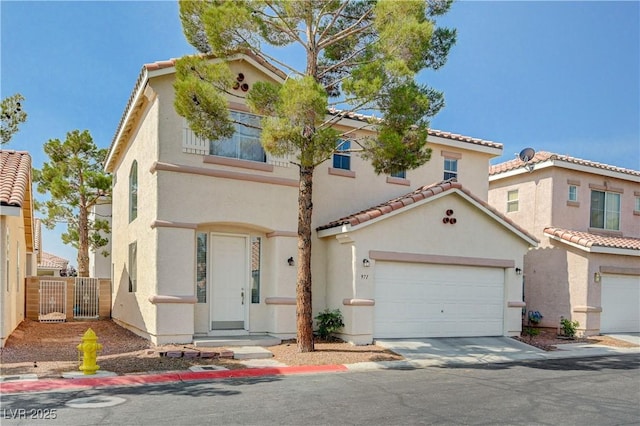 971 Whispering Grove Ave, Las Vegas, NV 89123 - mediterranean / spanish house featuring stucco siding, a tiled roof, driveway, and a garage