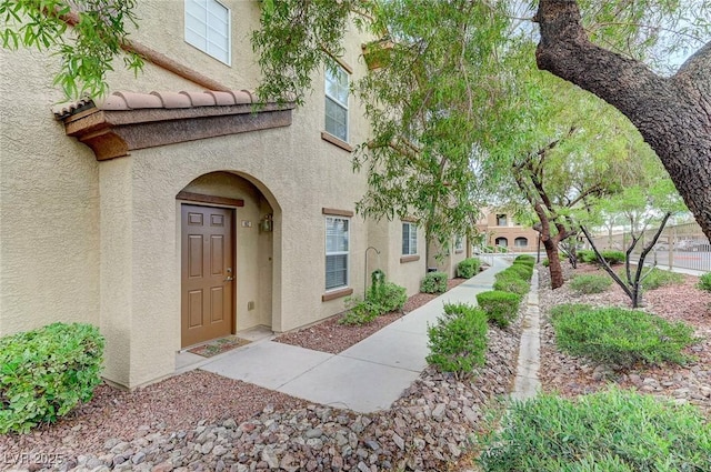 property entrance featuring stucco siding