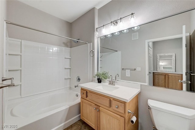 bathroom featuring shower / tub combination, toilet, and vanity