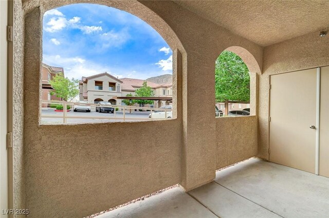 view of patio / terrace with a balcony and a residential view