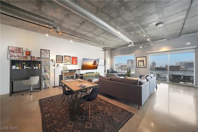 900 Las Vegas Blvd Unit 715, Las Vegas, NV 89101 - dining room featuring finished concrete flooring, a desk, and a high ceiling