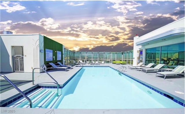 900 Las Vegas Blvd Unit 715, Las Vegas, NV 89101 - pool at dusk with a community pool, a patio, and fence