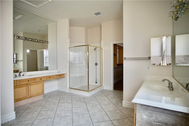 66 Sunset Bay St, Las Vegas, NV 89148 - full bathroom with a stall shower, two vanities, tile patterned flooring, and baseboards