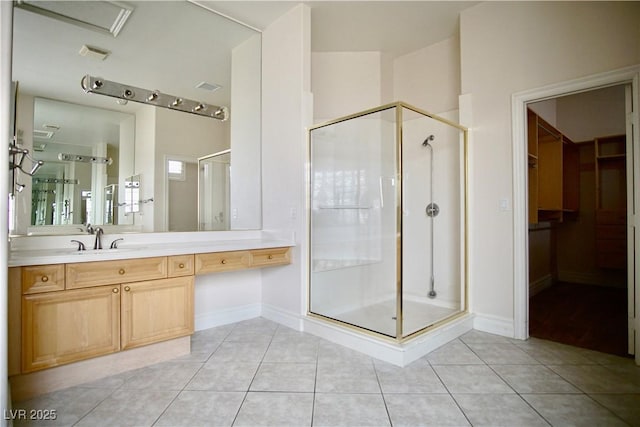 66 Sunset Bay St, Las Vegas, NV 89148 - full bath with a stall shower, tile patterned flooring, vanity, and baseboards