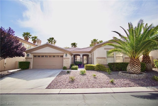 66 Sunset Bay St, Las Vegas, NV 89148 - mediterranean / spanish home with stone siding, stucco siding, a garage, concrete driveway, and a tile roof