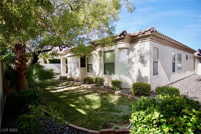 66 Sunset Bay St, Las Vegas, NV 89148 - view of side of property featuring stucco siding and a tiled roof