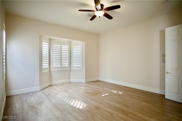 66 Sunset Bay St, Las Vegas, NV 89148 - spare room featuring wood finished floors, a ceiling fan, and baseboards