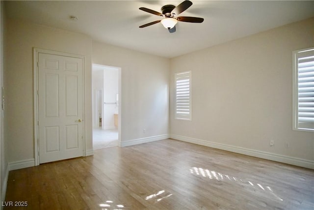 66 Sunset Bay St, Las Vegas, NV 89148 - empty room with a ceiling fan, healthy amount of natural light, wood finished floors, and baseboards