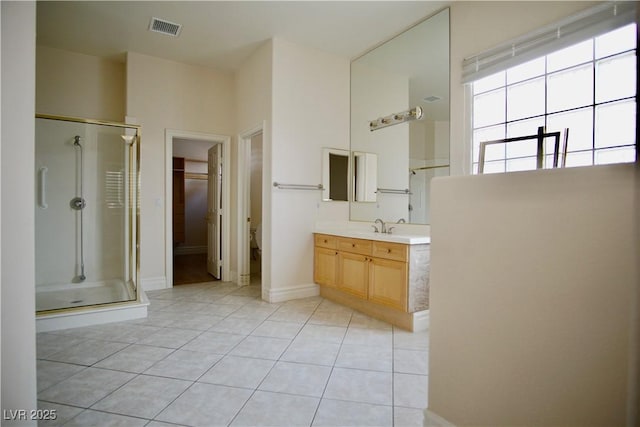 66 Sunset Bay St, Las Vegas, NV 89148 - full bath featuring a stall shower, tile patterned flooring, vanity, and toilet