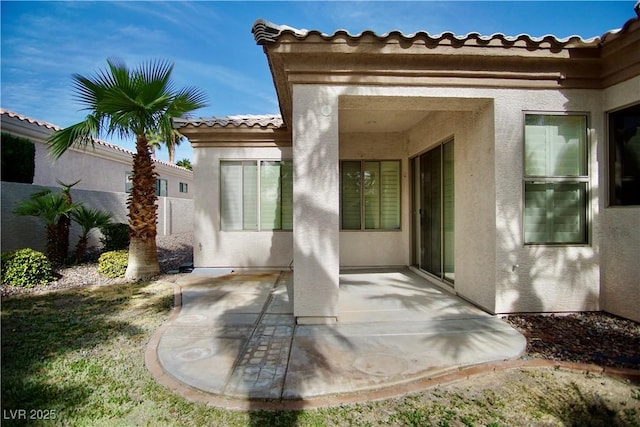 66 Sunset Bay St, Las Vegas, NV 89148 - rear view of property featuring stucco siding, a patio, and a tiled roof