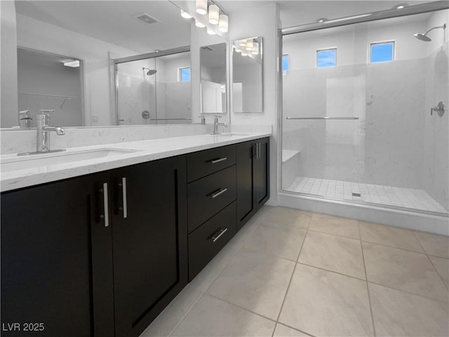 7791 Misty Oaks Ave, Las Vegas, NV 89113 - full bath featuring a stall shower, double vanity, and tile patterned floors