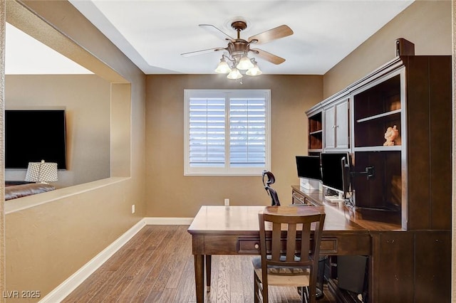 6409 Sea Swallow St, North Las Vegas, NV 89084 - office space with a ceiling fan, wood finished floors, and baseboards