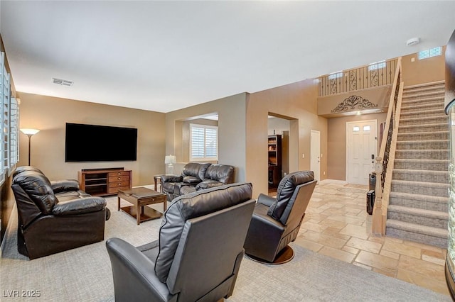 6409 Sea Swallow St, North Las Vegas, NV 89084 - living room with stone tile floors and stairs