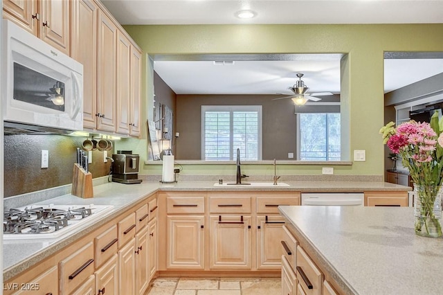 6409 Sea Swallow St, North Las Vegas, NV 89084 - kitchen featuring white appliances, a sink, and light brown cabinets
