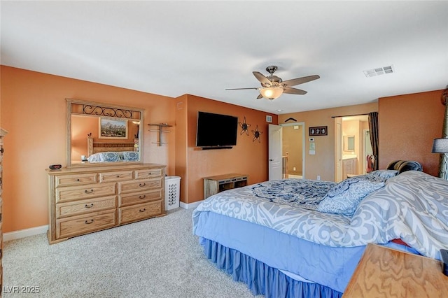 6409 Sea Swallow St, North Las Vegas, NV 89084 - bedroom featuring carpet, baseboards, ensuite bath, and ceiling fan