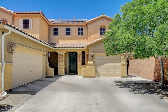 6409 Sea Swallow St, North Las Vegas, NV 89084 - mediterranean / spanish-style house featuring driveway, a tile roof, and stucco siding