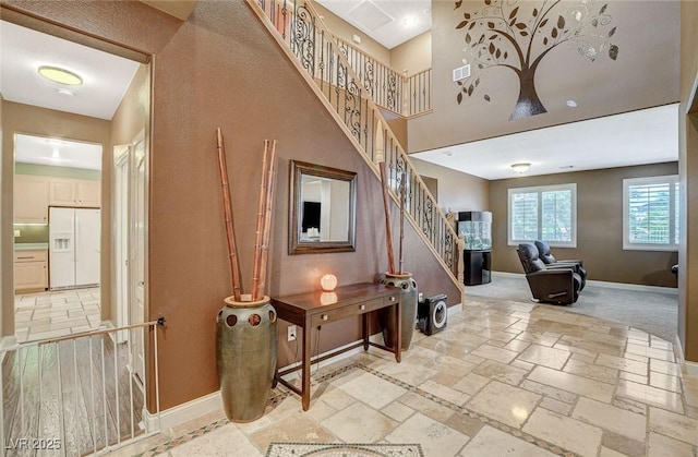 6409 Sea Swallow St, North Las Vegas, NV 89084 - staircase featuring baseboards and stone tile floors