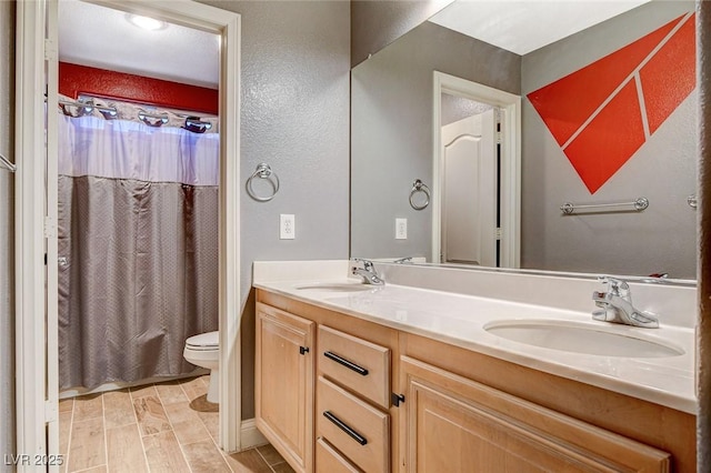 6409 Sea Swallow St, North Las Vegas, NV 89084 - bathroom featuring toilet and double vanity