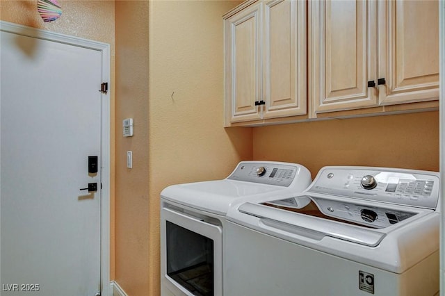 6409 Sea Swallow St, North Las Vegas, NV 89084 - laundry room featuring separate washer and dryer, cabinet space, and a textured wall