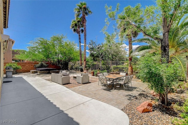 6409 Sea Swallow St, North Las Vegas, NV 89084 - view of patio featuring fence, an outdoor hangout area, and outdoor dining area