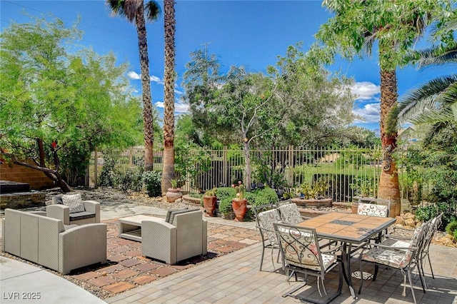 6409 Sea Swallow St, North Las Vegas, NV 89084 - view of patio / terrace featuring fence, outdoor lounge area, and outdoor dining area
