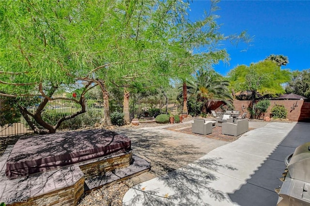 6409 Sea Swallow St, North Las Vegas, NV 89084 - view of patio / terrace with an outdoor hangout area and a fenced backyard