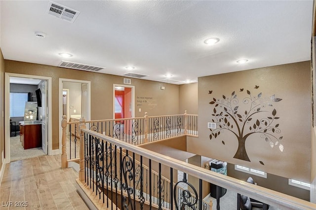 6409 Sea Swallow St, North Las Vegas, NV 89084 - hallway with an upstairs landing and recessed lighting
