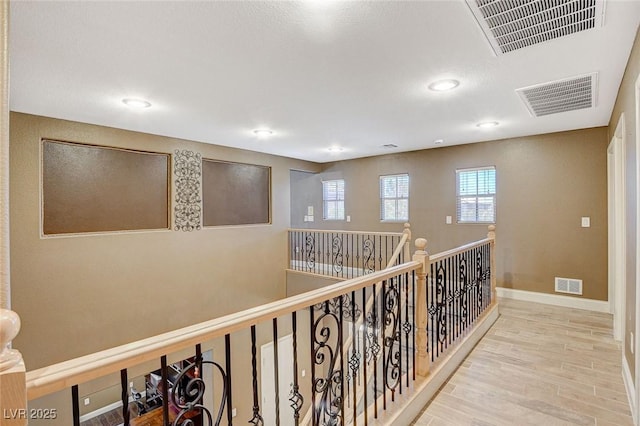 6409 Sea Swallow St, North Las Vegas, NV 89084 - hallway featuring wood finished floors, recessed lighting, and baseboards