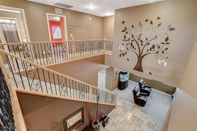 6409 Sea Swallow St, North Las Vegas, NV 89084 - stairs with stone finish floors, carpet, and baseboards
