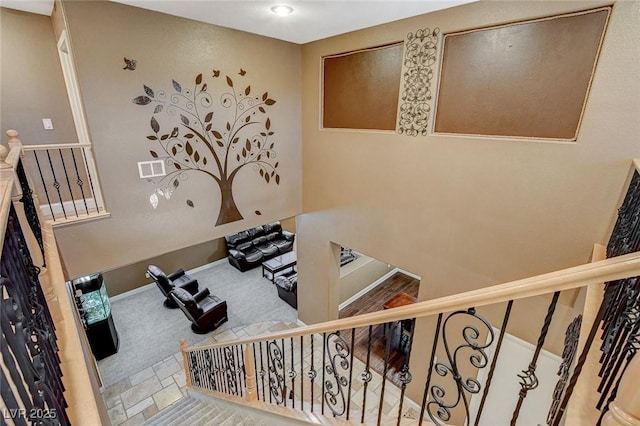6409 Sea Swallow St, North Las Vegas, NV 89084 - stairway with baseboards and carpet