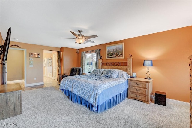 6409 Sea Swallow St, North Las Vegas, NV 89084 - bedroom with carpet flooring, baseboards, a ceiling fan, and ensuite bathroom