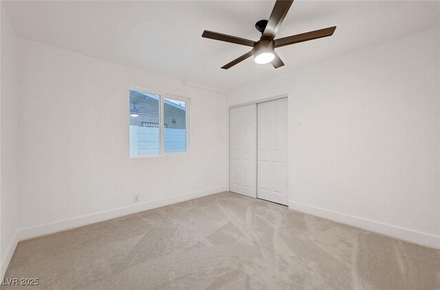2521 Richfield Blvd, Las Vegas, NV 89102 - unfurnished bedroom featuring light colored carpet, baseboards, a closet, and a ceiling fan