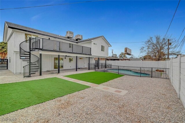 2521 Richfield Blvd, Las Vegas, NV 89102 - rear view of property with stairs, a patio area, stucco siding, and a balcony