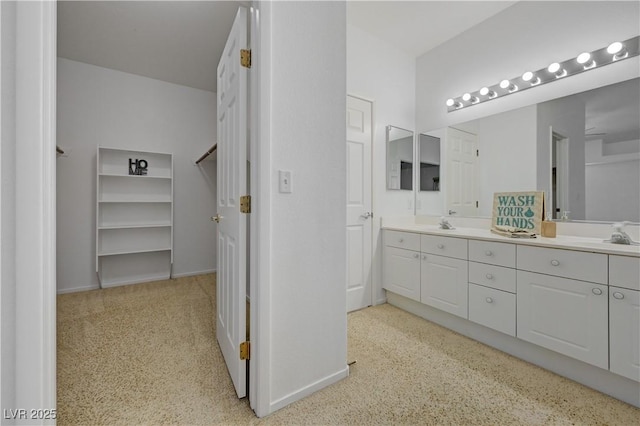 10525 Pine Glen Ave Unit 206, Las Vegas, NV 89144 - bathroom with carpet, double vanity, and baseboards